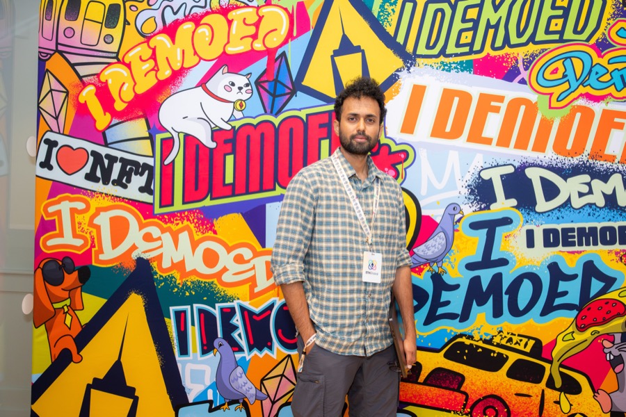 Manoj at ETHGlobal 2025, in front of the I Demoed backdrop